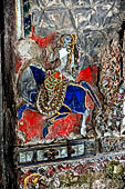 Glass mosaics depicting Buddhist stories lining walls around stupa in Shwe Yaunghwe Kyaung. Buddhist monastery, near Inle Lake. Myanmar. 